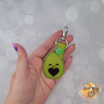 Avocado vinyl key fob, faux leather snap tab, avocado luggage tag