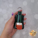 Green and black striped vinyl asthma inhaler holder keychain