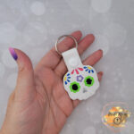 Sugar skull day of the dead vinyl keychain, faux leather luggage snap tab, purse zipper pull key fob