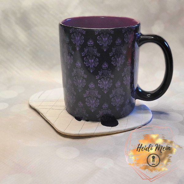 Halloween Pail Ghost Mug Rug shown with cup