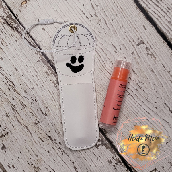 Halloween Pail Ghost balm holder fob shown with lip balm