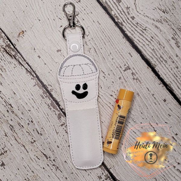 Halloween Pail Ghost balm holder snap tab shown with chapstick