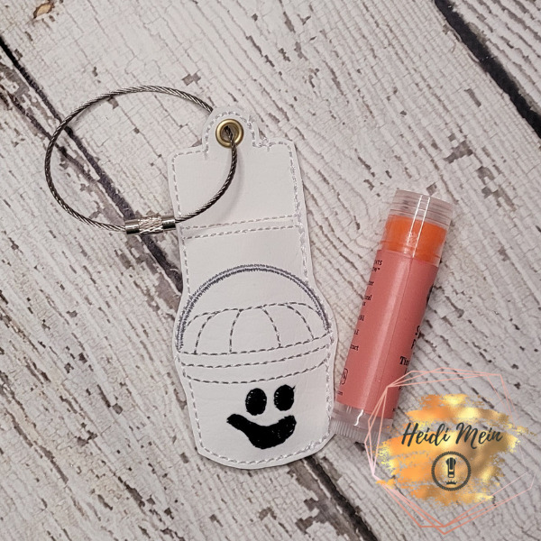 Halloween Pail Ghost lip balm holder fob shown with chapstick