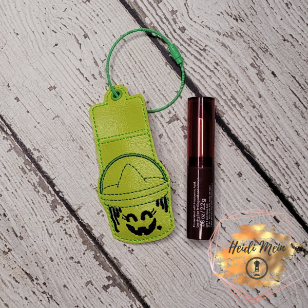 Halloween Pail Witch lip balm holder fob shown with chapstick