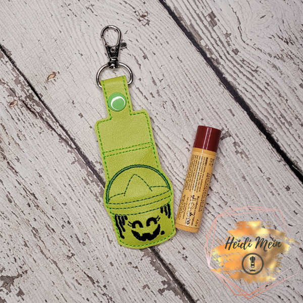 Halloween Pail Witch lip balm holder snap tab shown with lipstick