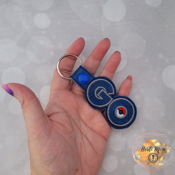 glitter pokie go keychain